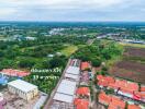 Aerial view of a residential area with surrounding greenery