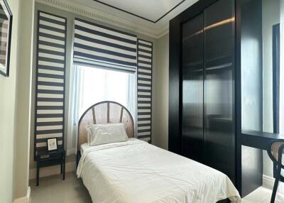 Modern bedroom with single bed and large wardrobe