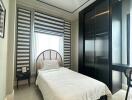 Modern bedroom with single bed and large wardrobe
