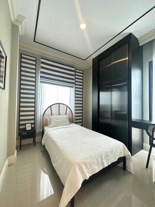 Modern bedroom with single bed and large wardrobe