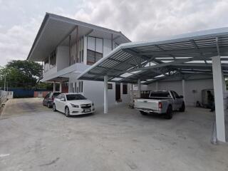 Parking area and a two-story modern house