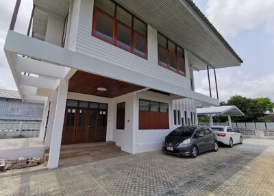 Modern two-story house with parking area