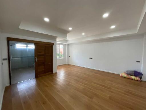 Spacious living room with wooden flooring