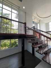 Spacious stairway with large windows