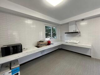 Modern kitchen with counter space and window