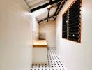 Modern narrow kitchen with tiled floor and wooden countertops