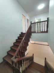 Staircase with wooden handrails