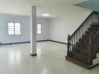 Open and spacious living room with staircase