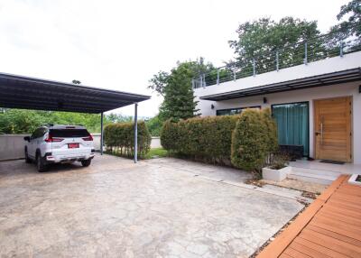 Exterior view of a modern house with a carport