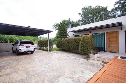 Exterior view of a modern house with a carport