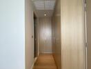 Bright modern hallway with wooden flooring and built-in storage