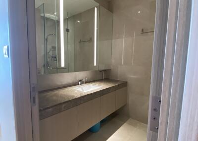 Modern bathroom with large mirror and under-sink storage