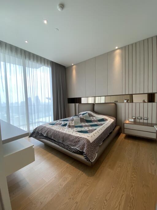 Modern bedroom with large window