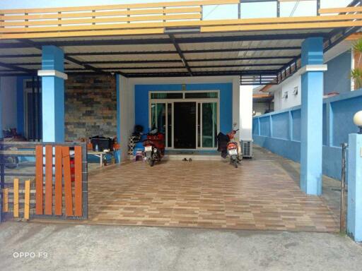 Covered garage with tiled floor