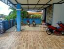 covered outdoor area with motorbikes and seating