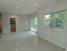 Spacious living area with large windows and natural light