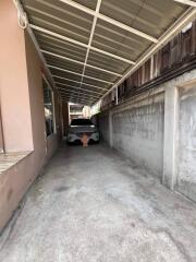 Carport with a parked car