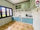 Modern kitchen with blue and white cabinets