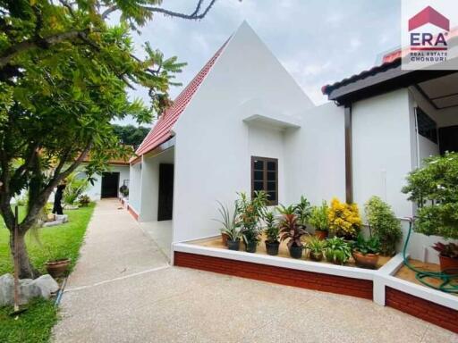 Front view of a modern house with a garden