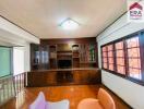 Living room with built-in wooden shelves and window with a view