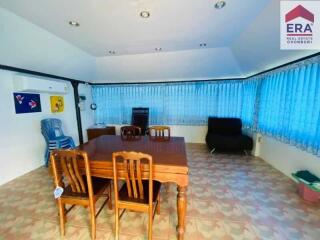 Spacious main living area with dining table