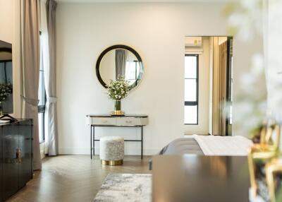 Modern bedroom with a vanity table and mirror