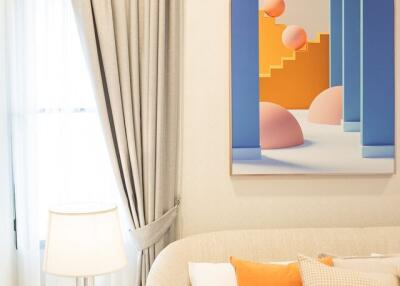 Cozy bedroom with abstract art and bedside lamp