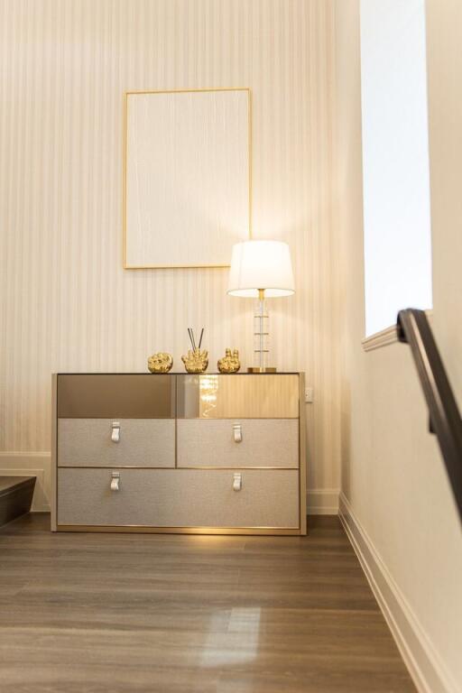 Modern living room corner with chest of drawers and lamp