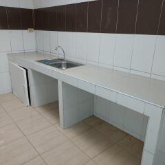 Simple kitchen with white tile countertops and backsplash