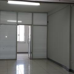 Empty office space with glass partitions