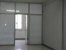 Empty office space with glass partitions