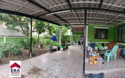 Covered outdoor area with garden and seating