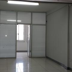 Interior of a commercial office space with glass partitions