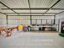 Outdoor kitchen area with appliances and large wooden table