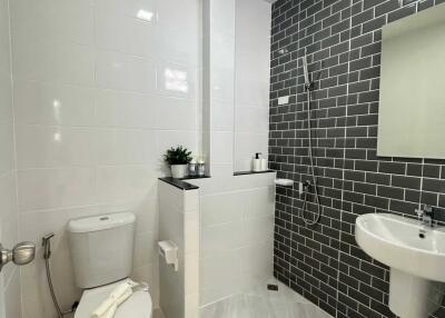 Modern bathroom with grey and white tiles