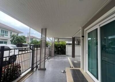 covered front patio with frosted sliding doors