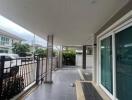 covered front patio with frosted sliding doors