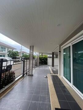 covered front patio with frosted sliding doors