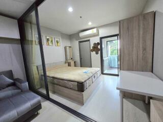 Modern bedroom with glass partition and balcony access