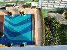 Aerial view of a shared swimming pool in a residential complex