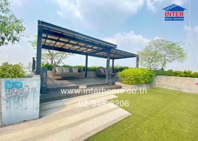 Rooftop co-working space with seating and greenery