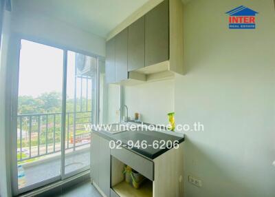 Compact kitchen with balcony access