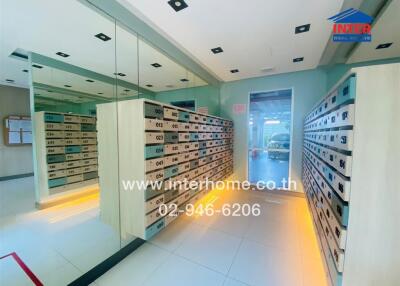 Mailroom with multiple mailboxes and mirror walls