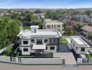 Aerial view of a large modern house with landscaped garden