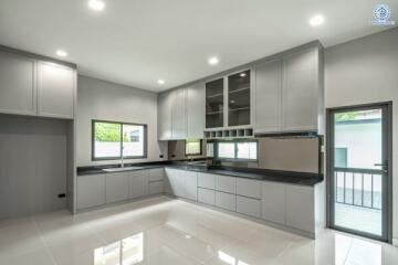 Modern Kitchen with Grey Cabinets and Large Windows