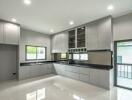 Modern Kitchen with Grey Cabinets and Large Windows