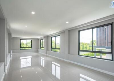 Spacious Living Area with Large Windows and Natural Light