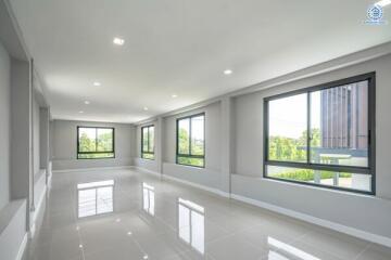 Spacious Living Area with Large Windows and Natural Light