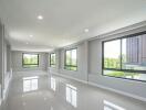 Spacious Living Area with Large Windows and Natural Light