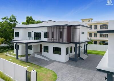 Modern two-story house with a driveway and lawn